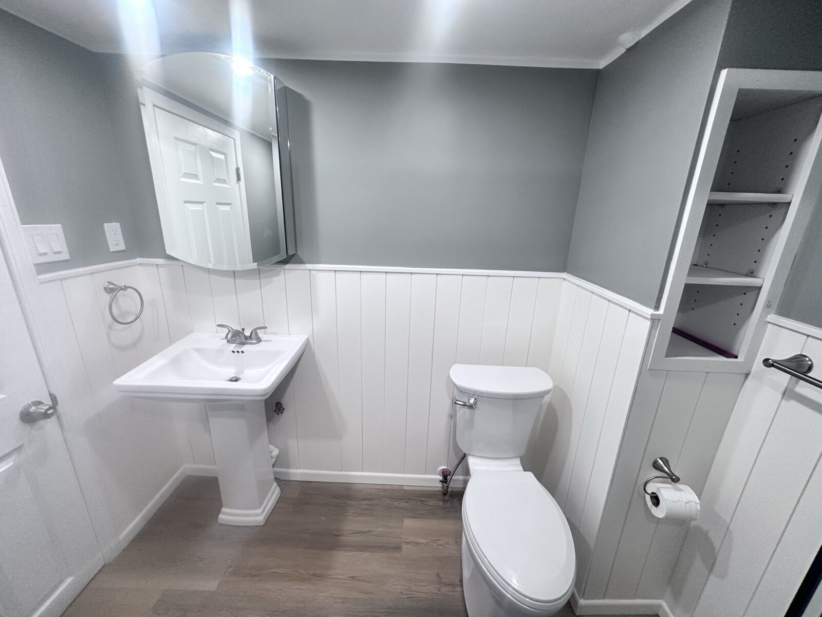 After: Same basement bath, the vanity wall
