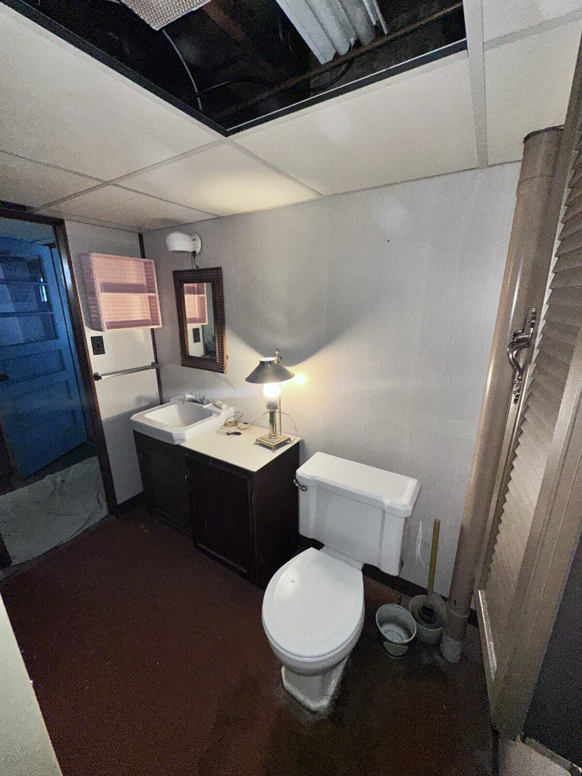 Before: Same basement bath, the vanity wall