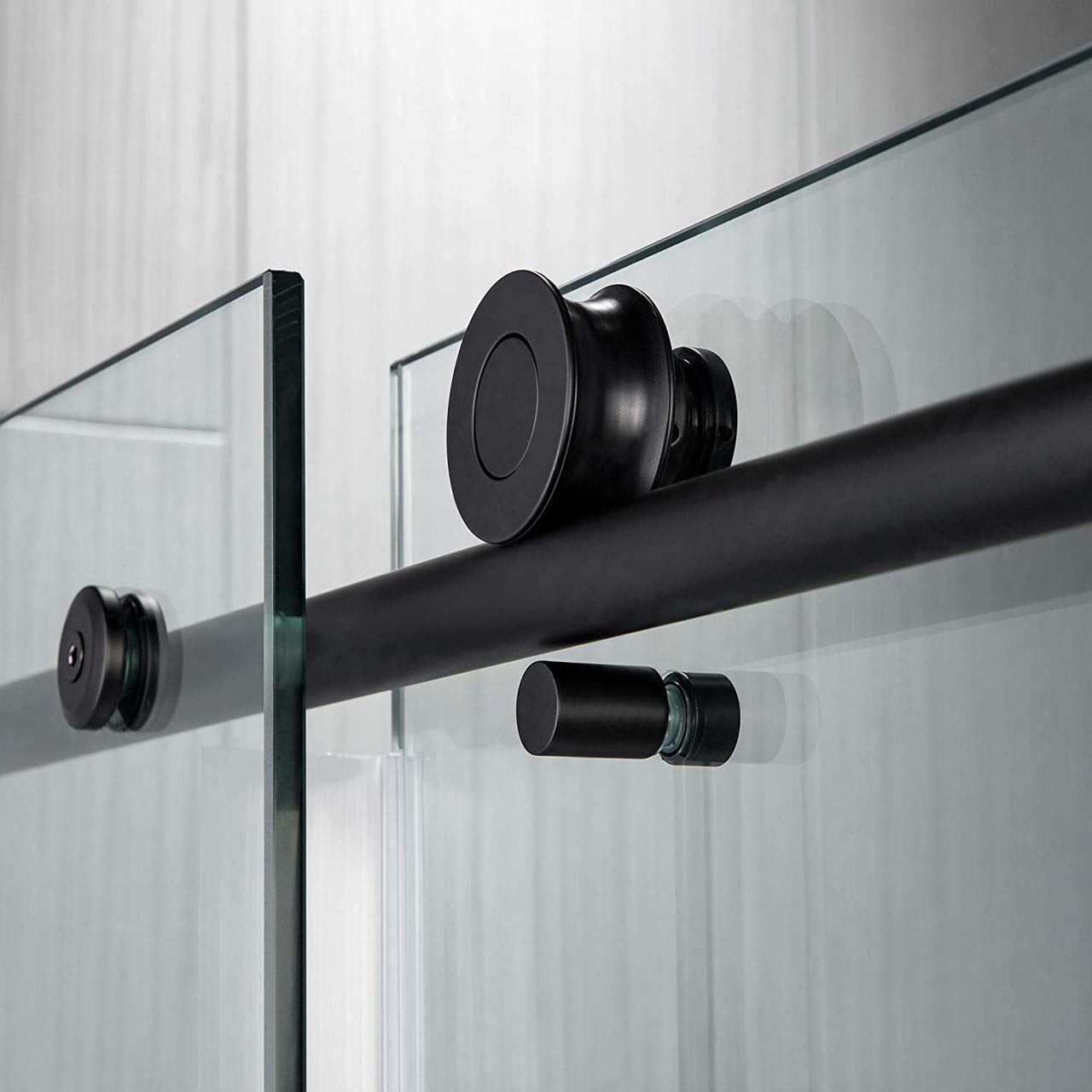 Semi-frameless sliding shower door with brushed-nickel hardware, Just Bath