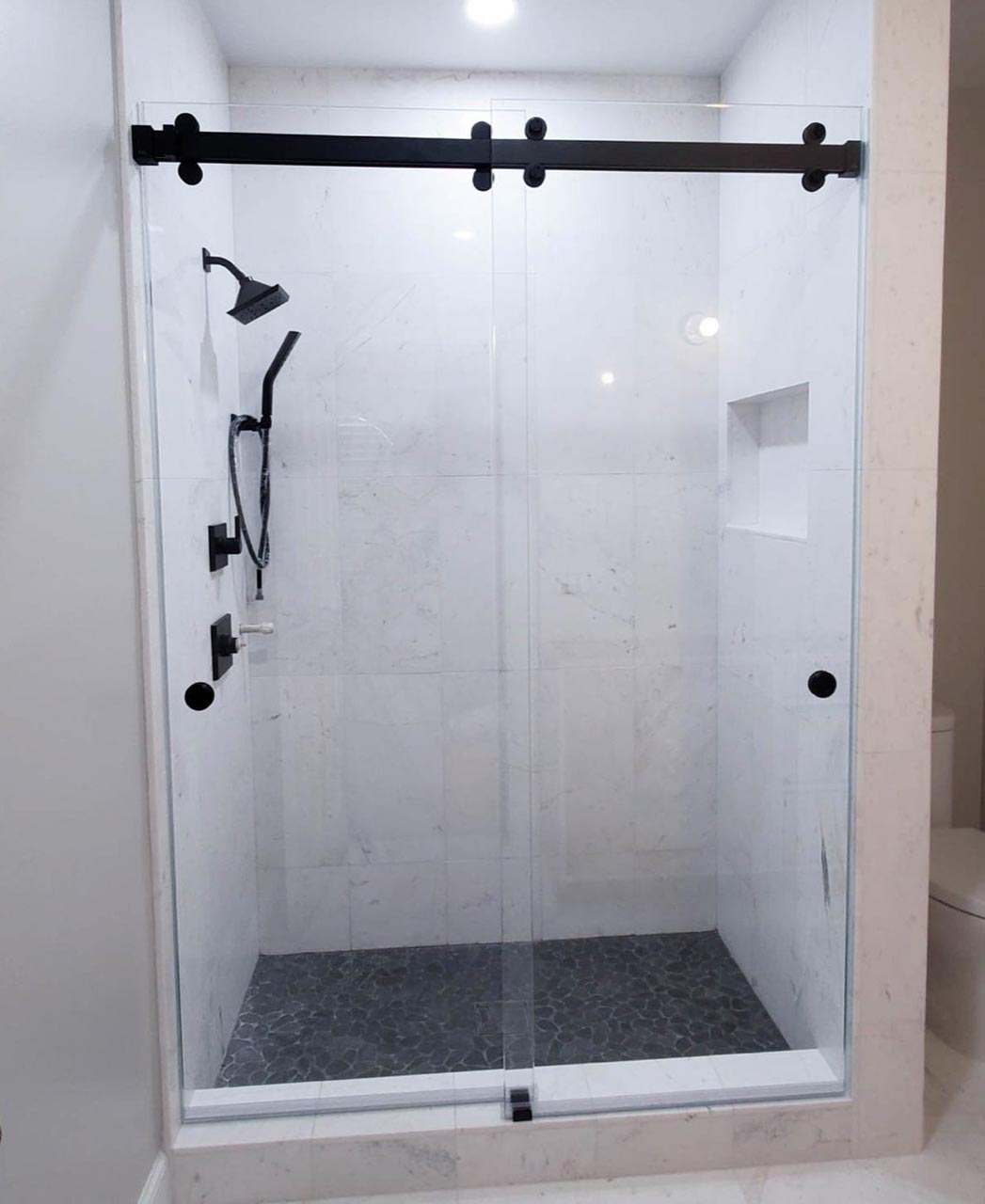 Bypass sliding glass shower door installed by Just Bath, Pittsburgh