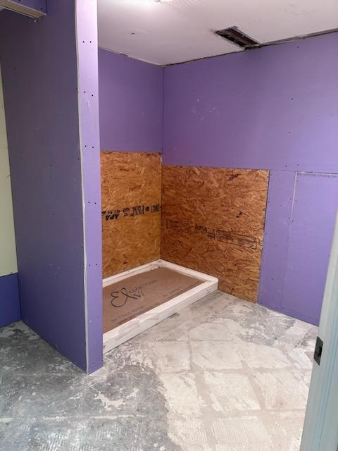 A bathroom conversions project stripped down during the demolition process. A new Elvi shower base was installed. 